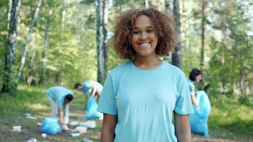 Portrait of a cheerful young woman volunteer